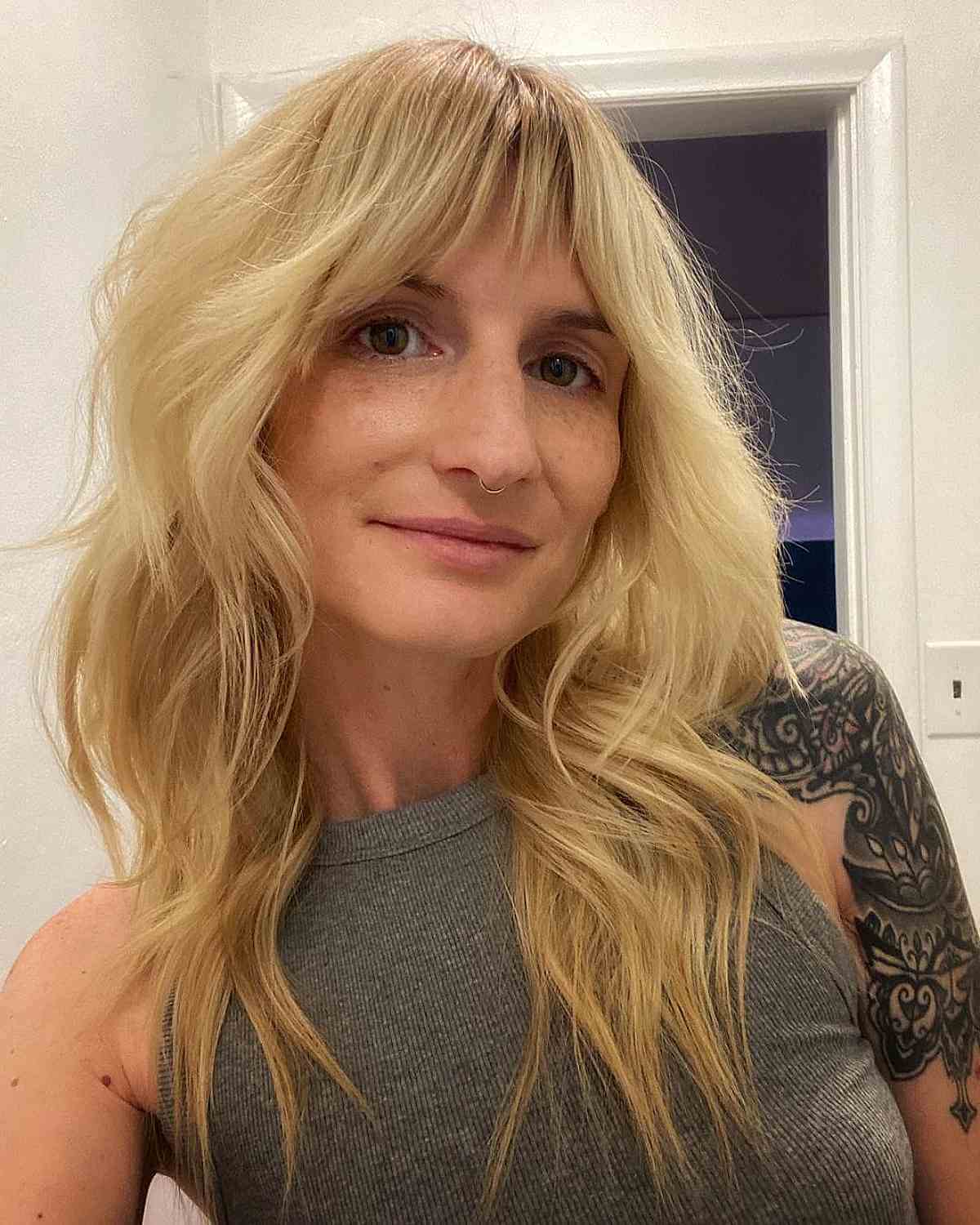 Feathery Shag Hairstyle with a Flattering Bottleneck Fringe