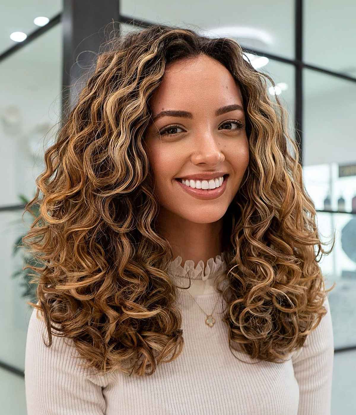 flawless long curly hair with a center part