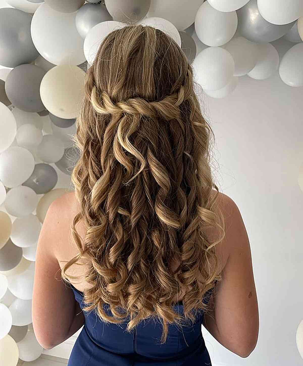 Flowing Twists and Curls on Downed Long Hair for Prom Night