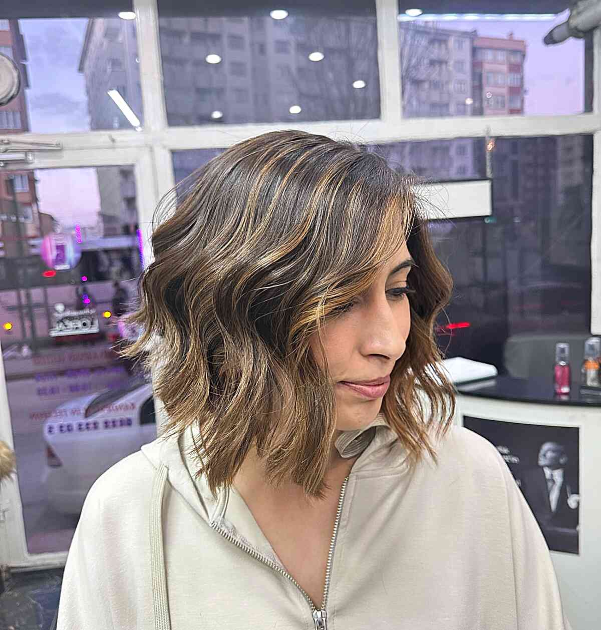 Full-Bodied Bronde Long Inverted Choppy Bob with Effortless Waves