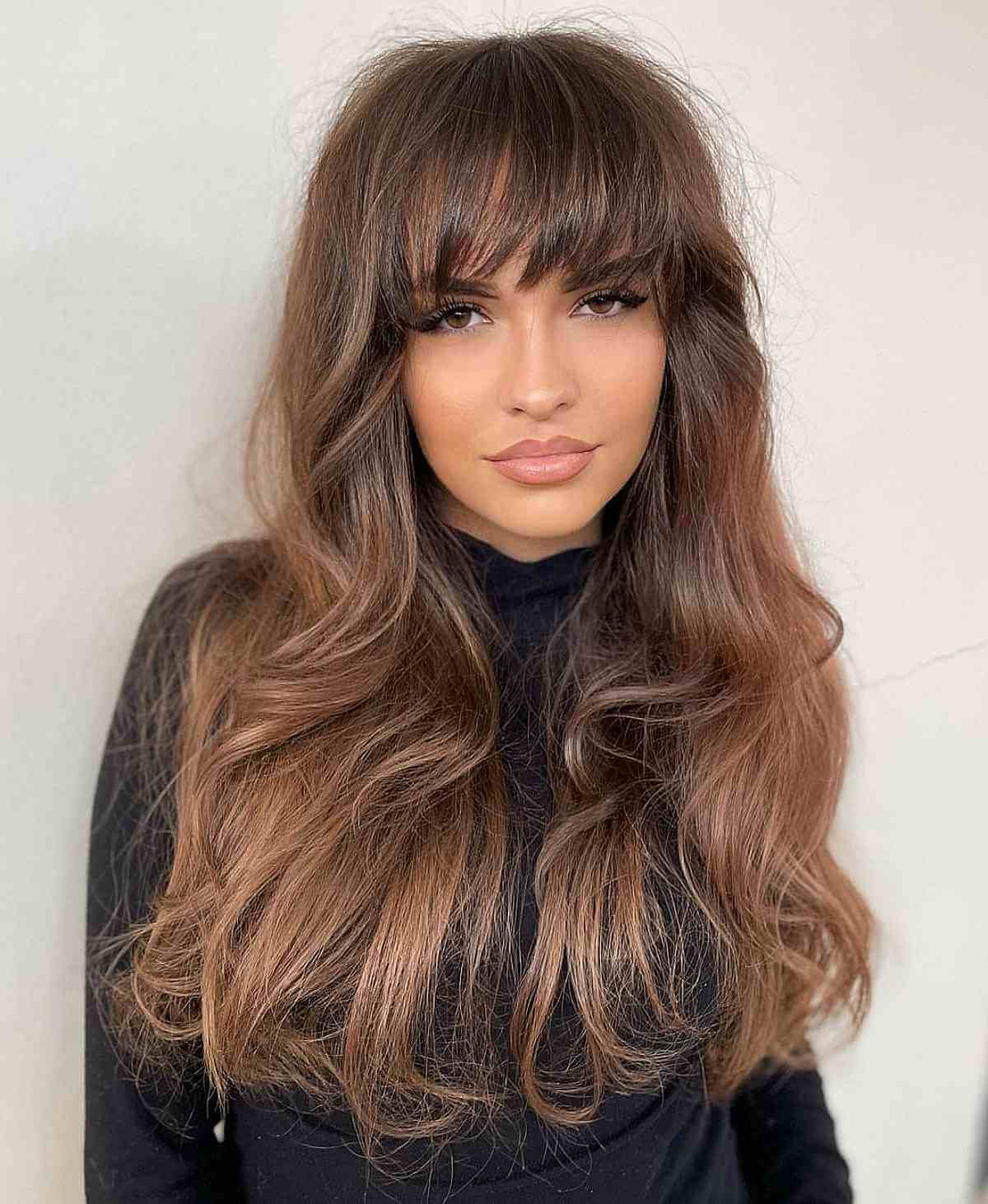 Gentle Layers and a Fringe on Long Frizzy Hair