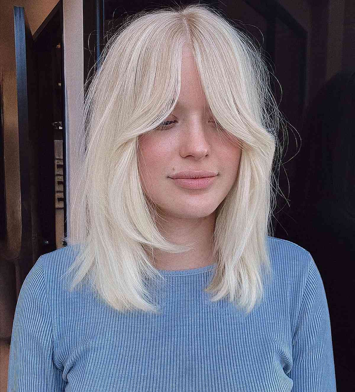 Gentle Shag Cut with Face-Framing Layers and Bottleneck Bangs