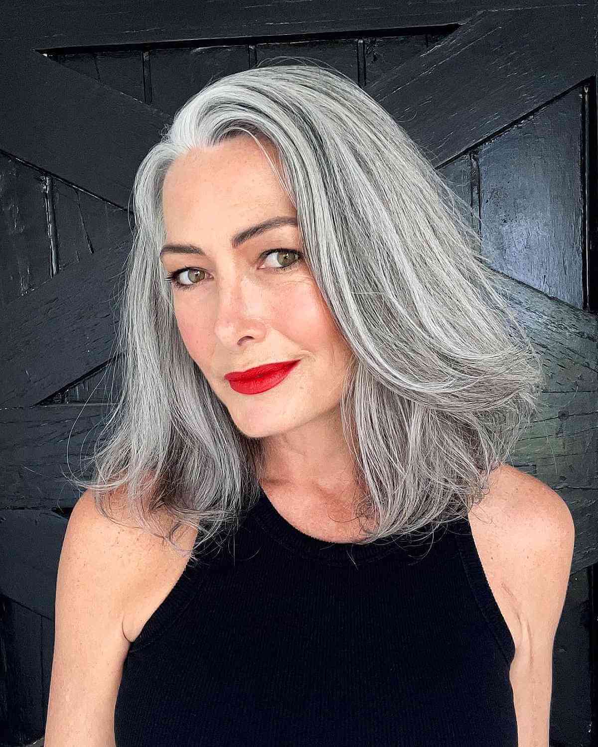 Gently Layered Silver Long Bob for a Lady Over 50