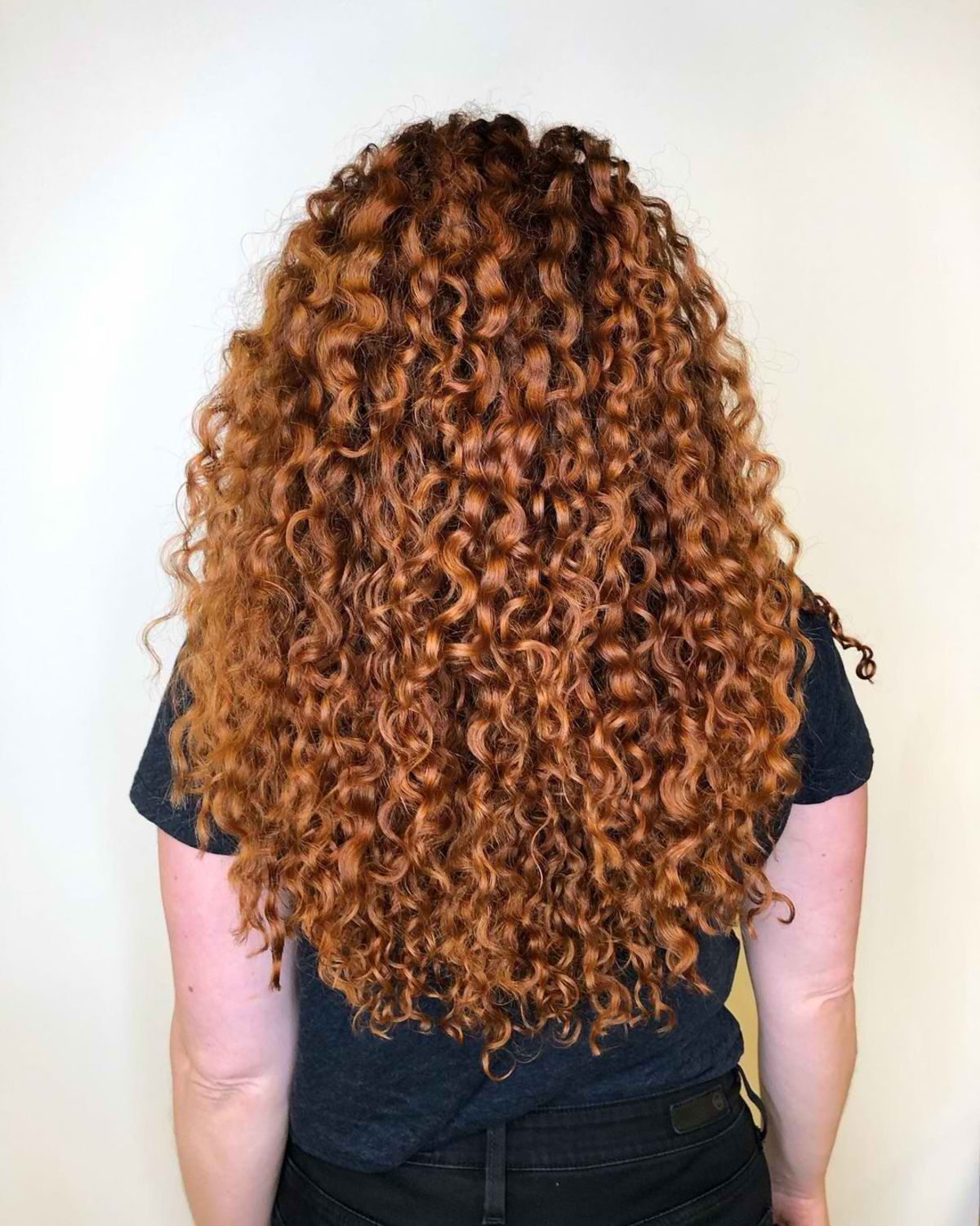 Gorgeous coppery tight curls for longer hair