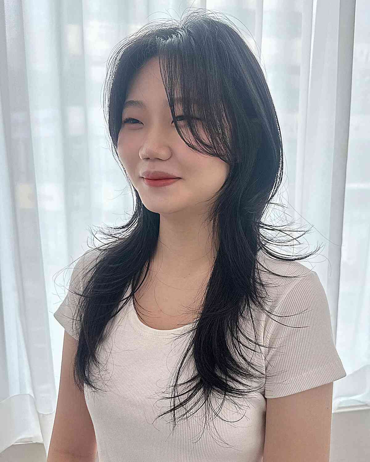 Chest-Length Straight Hush Cut Featuring Long Swoop Bangs