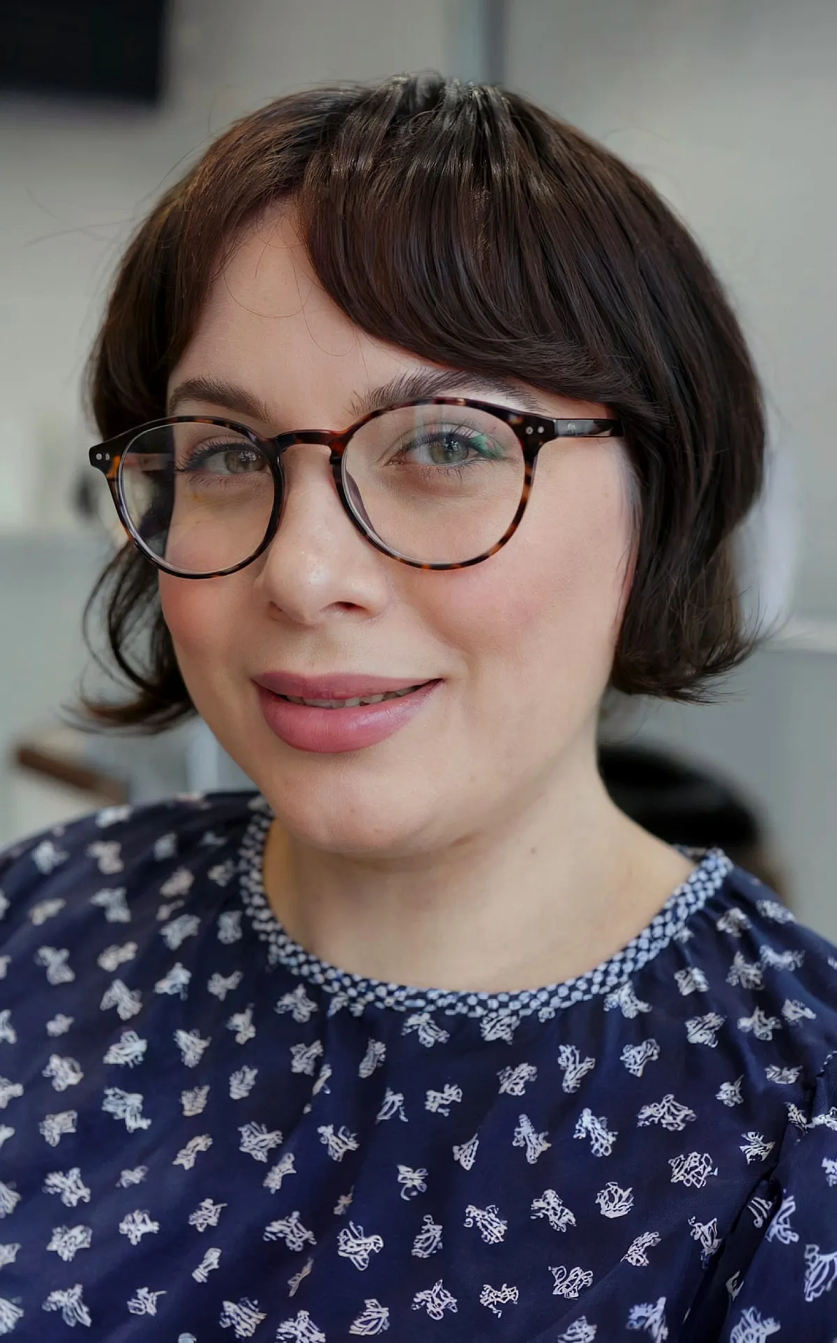 Jaw-Length Bob with Fringe and Center Part for Round Face Shapes