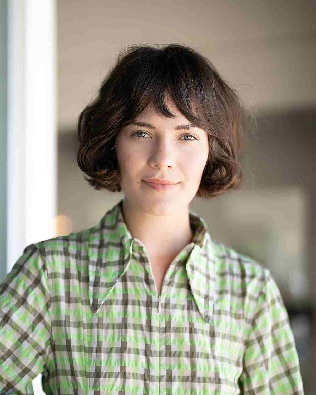 Jaw-Length Wavy French Bob featuring Bangs