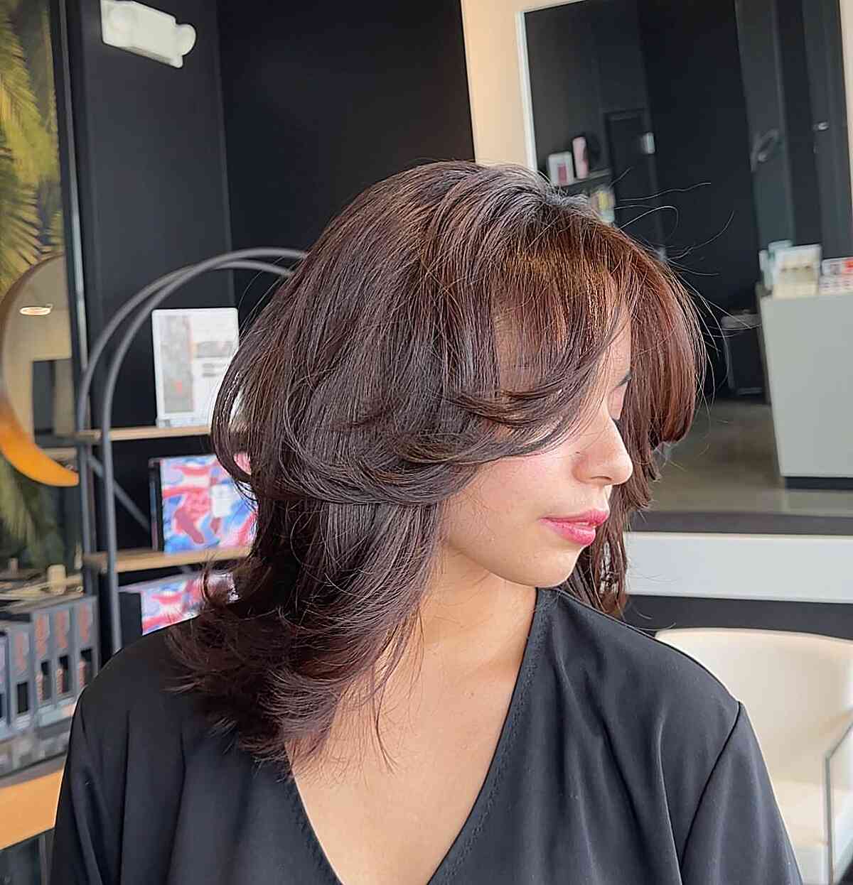 Layered Bangs with a Mid-Length Feathered Hairstyle