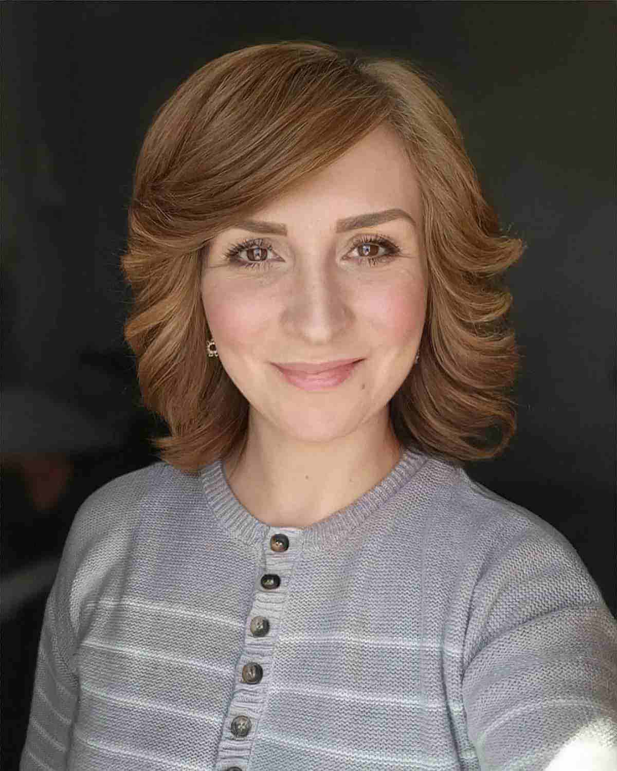 Mid-Length Layered Feathered Shag with Side-Swept Bangs