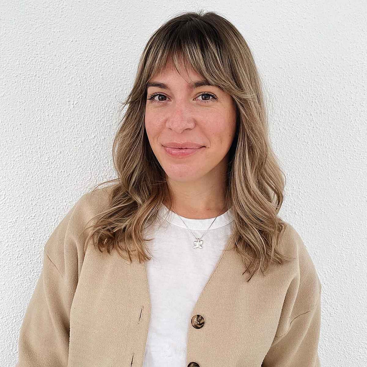 Layered Hairstyles with Feathered Bangs