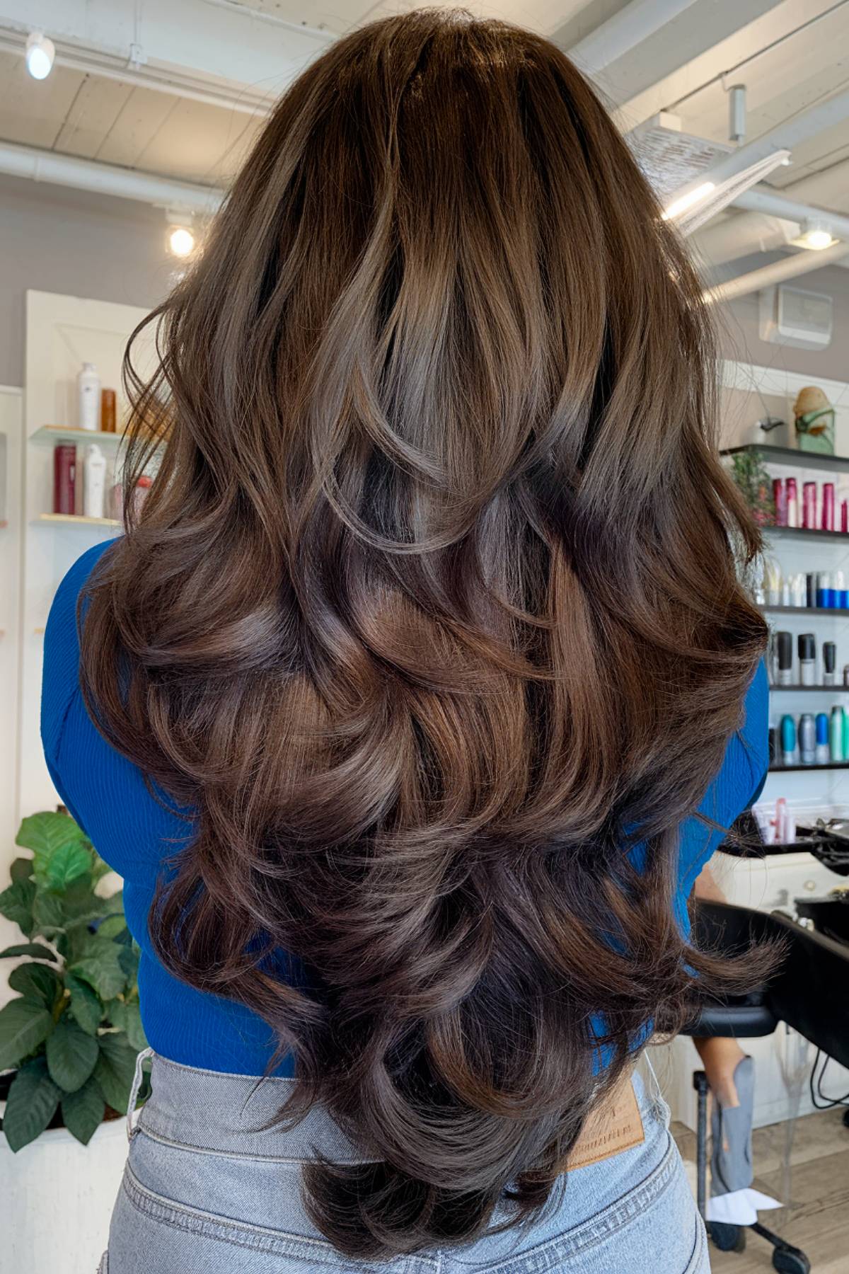 Layered step cut hairstyle for long tresses