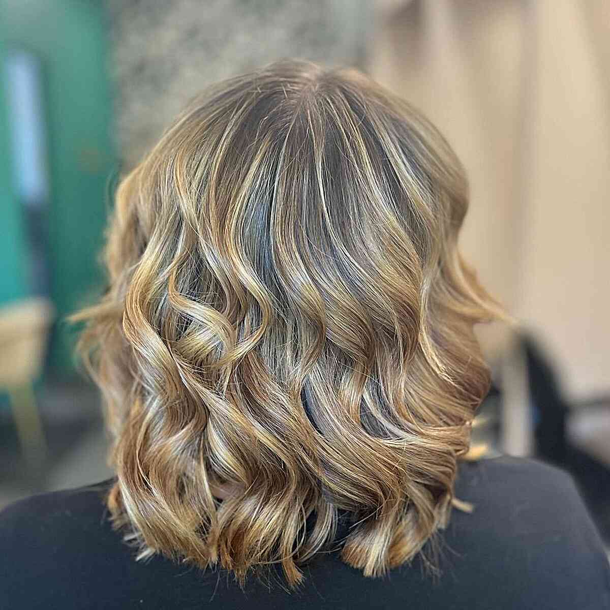 Shoulder length layers in sunset blonde