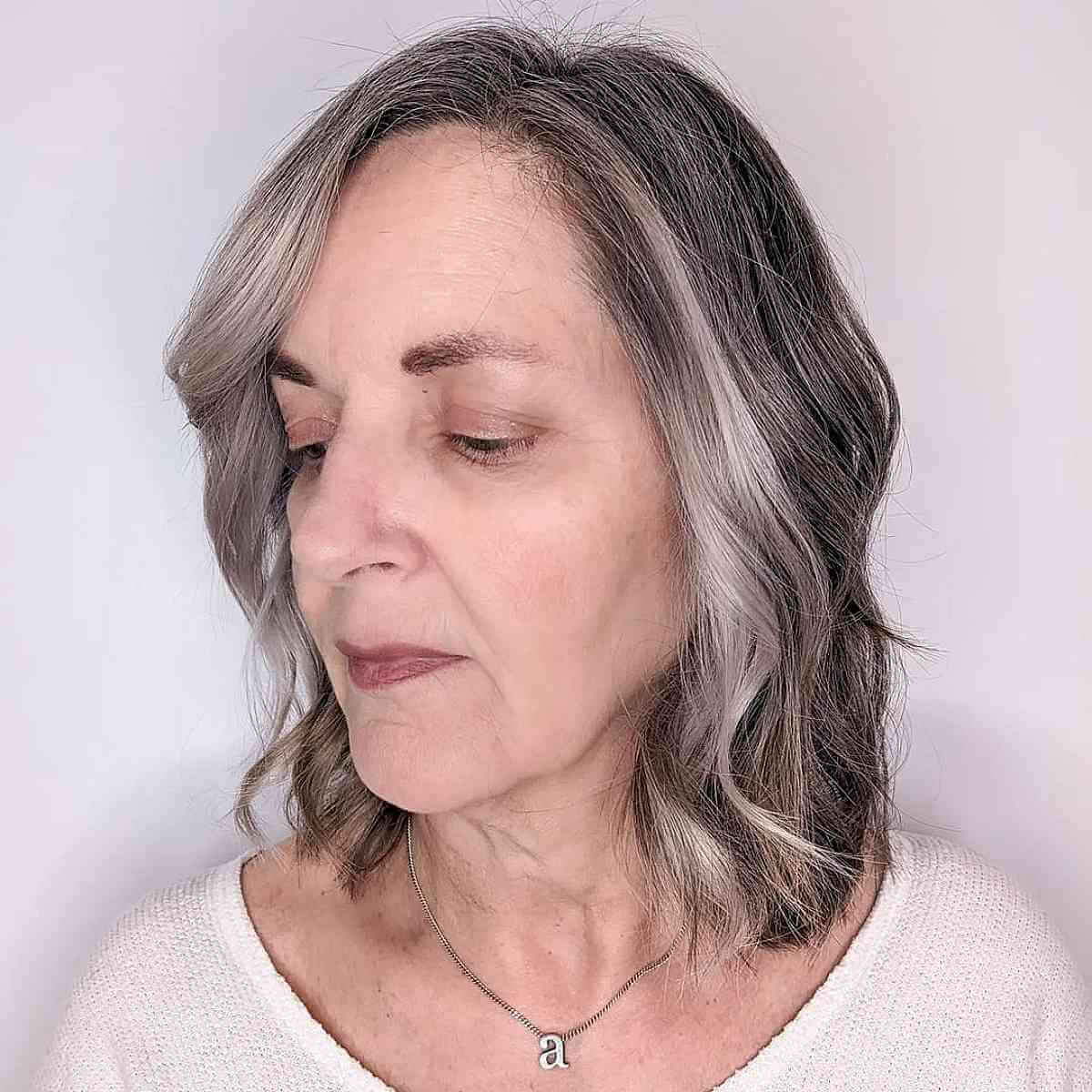 Layered Waves at Neck Length for a 60-Year-Old Woman