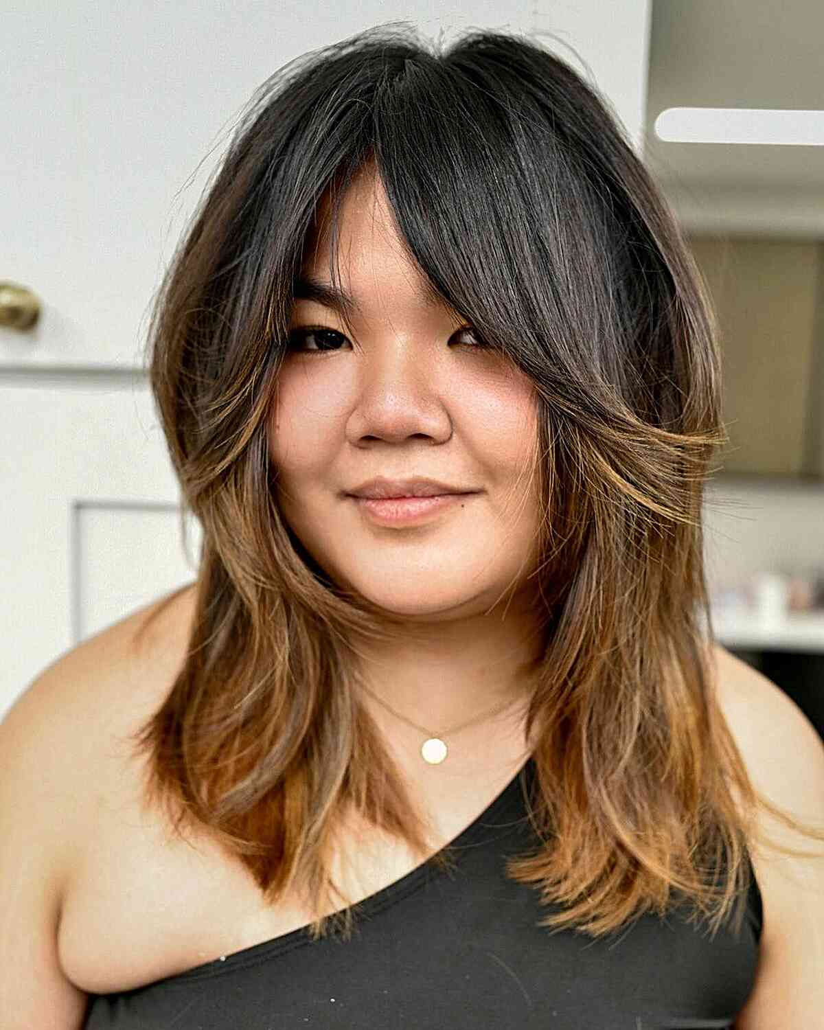 Lengthy Bangs with a Mid-Length Chop for Women with Double Chins