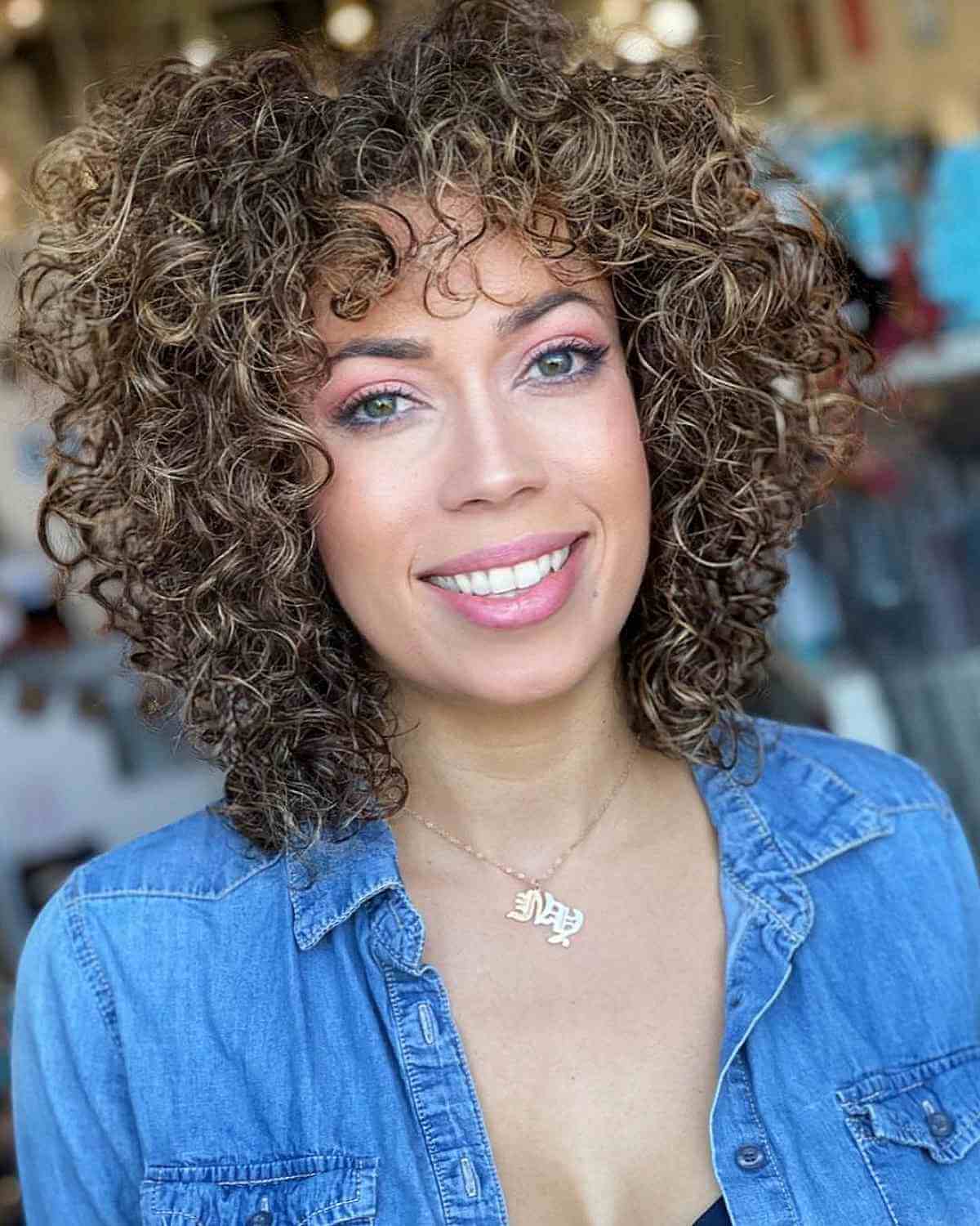 Light Brown Curly Hair Featuring Blonde Highlights