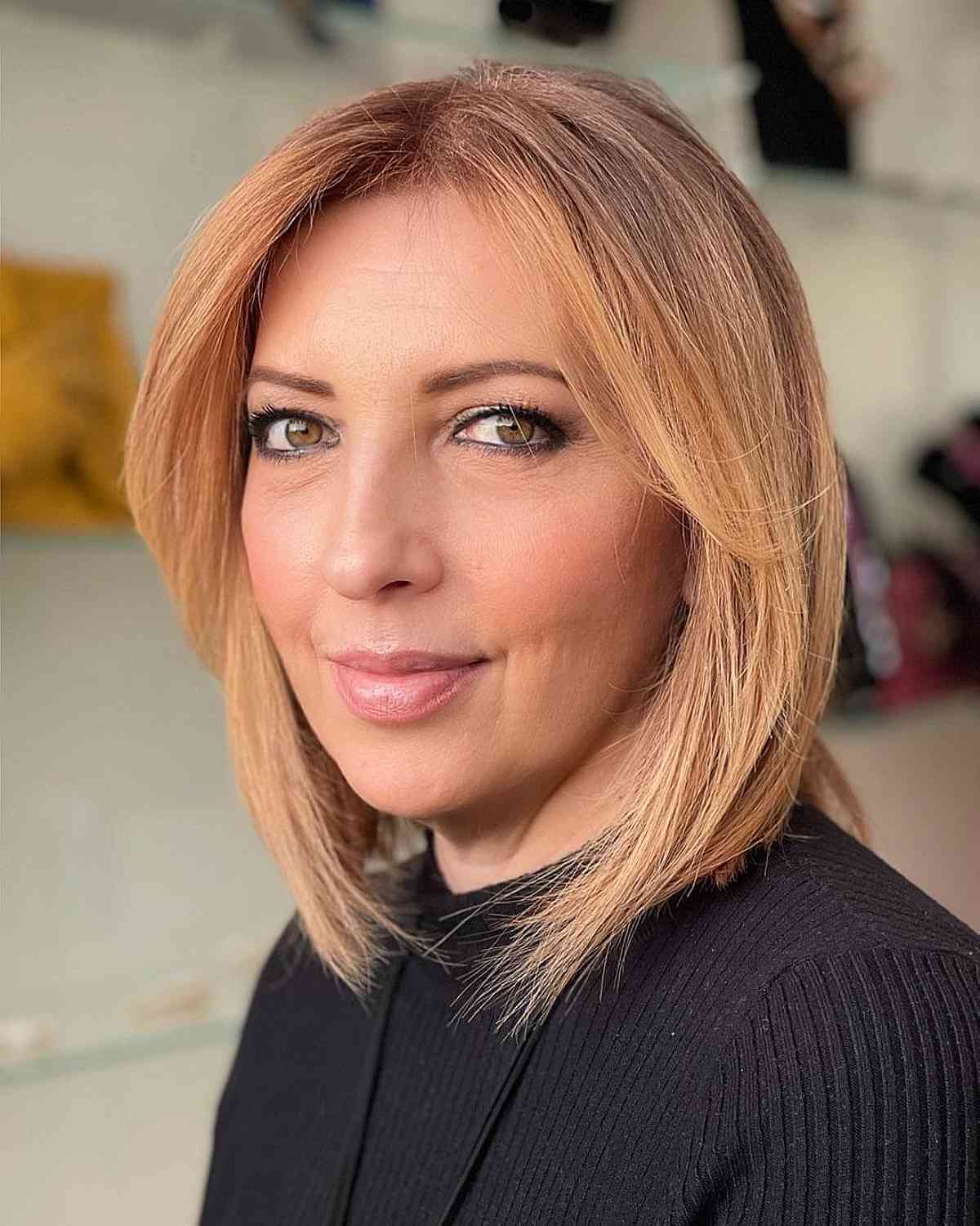 Lob with Stylish Face-Framing Bangs for Women Over 50 with Thinning Hair