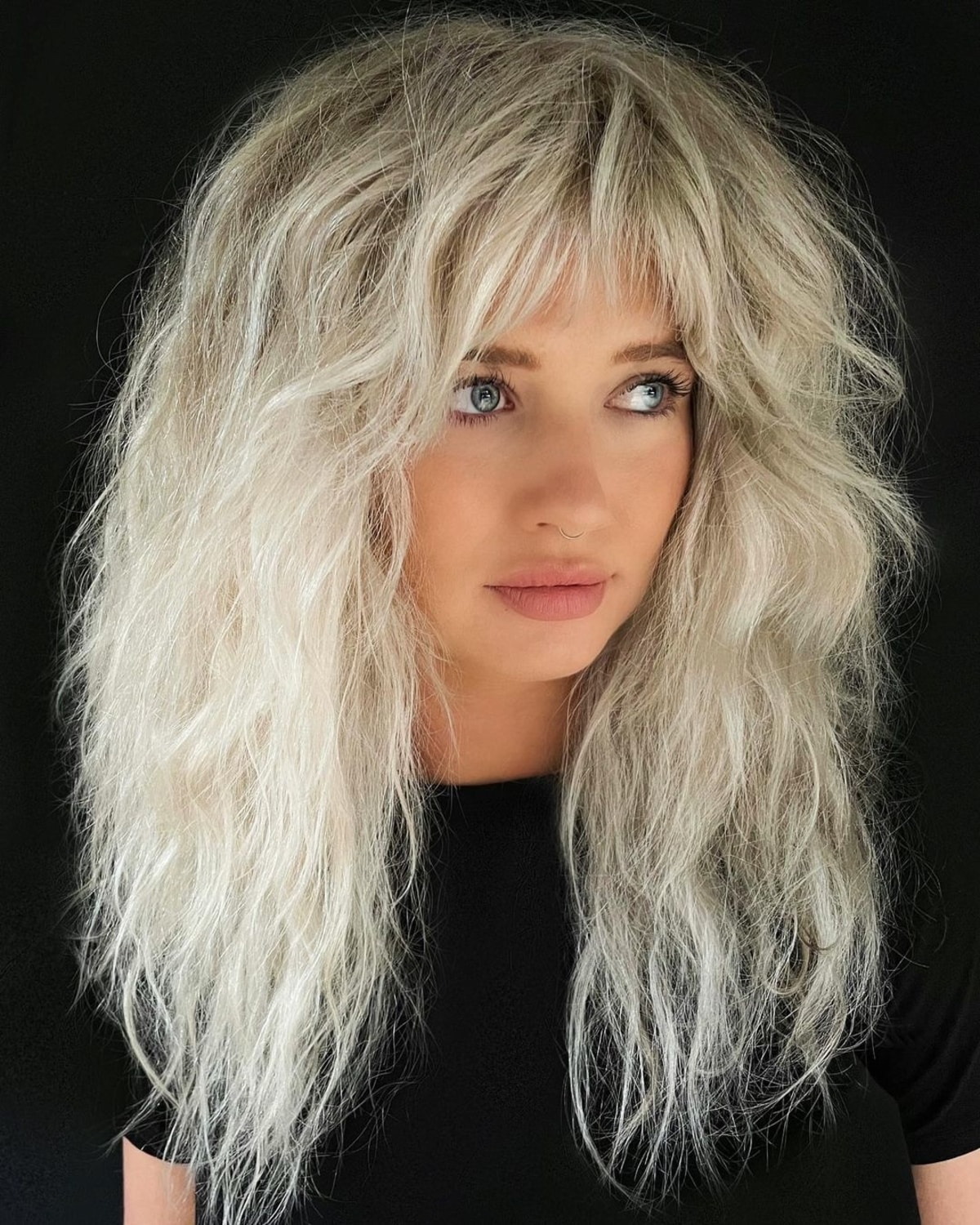 Razor cut for long blonde hair with bangs