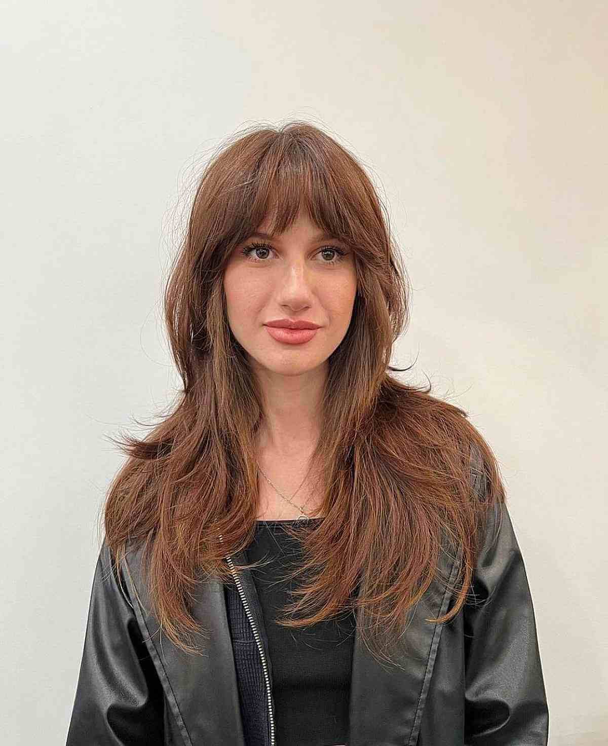Long Layers Featuring Face-Framing Bangs