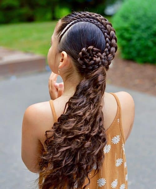 curly hair braided low for homecoming