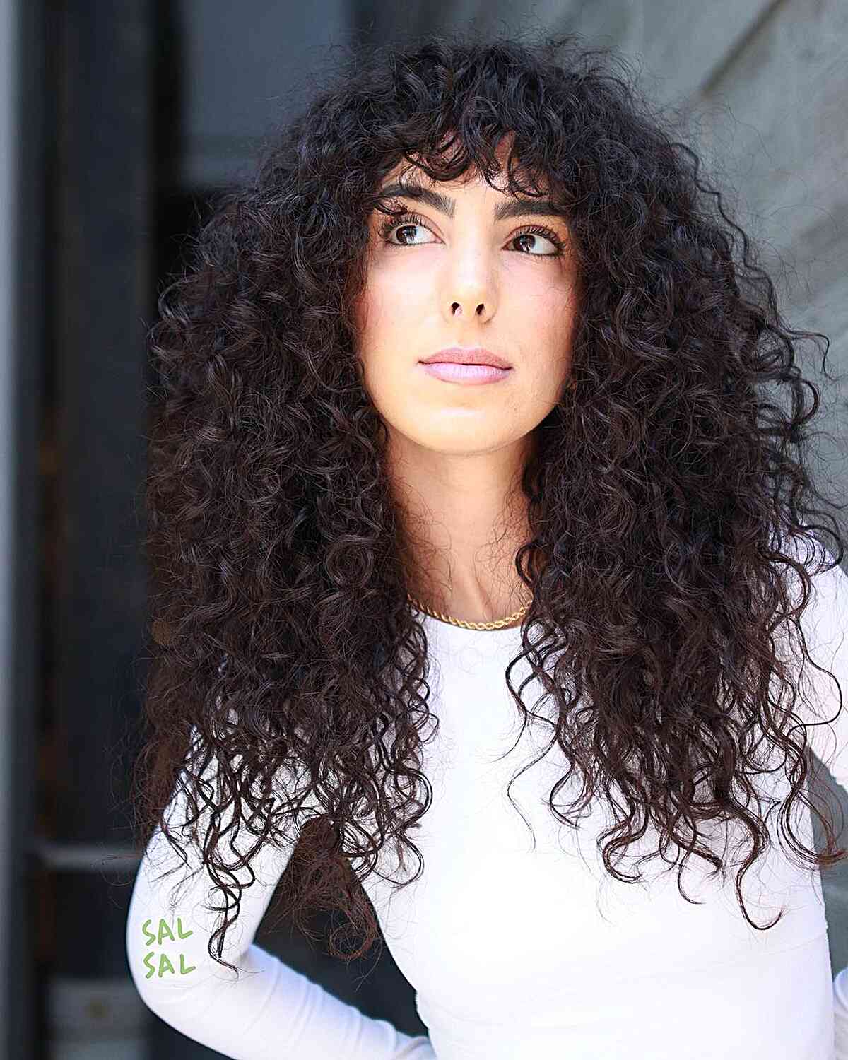 Luxurious and Vibrant Long Curls and Bangs for ladies with thick curly hair