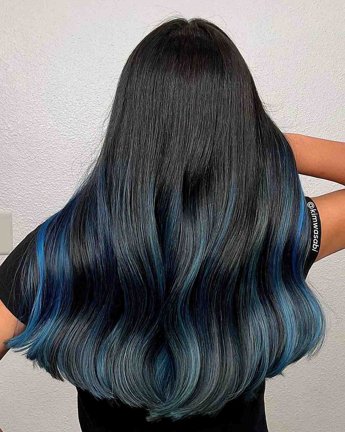 luxurious black locks with striking blue highlights