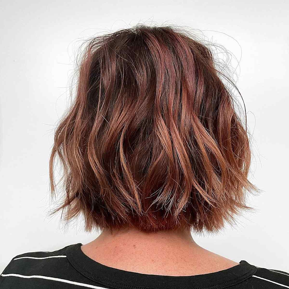 Luxurious chocolate brown hair with red highlights