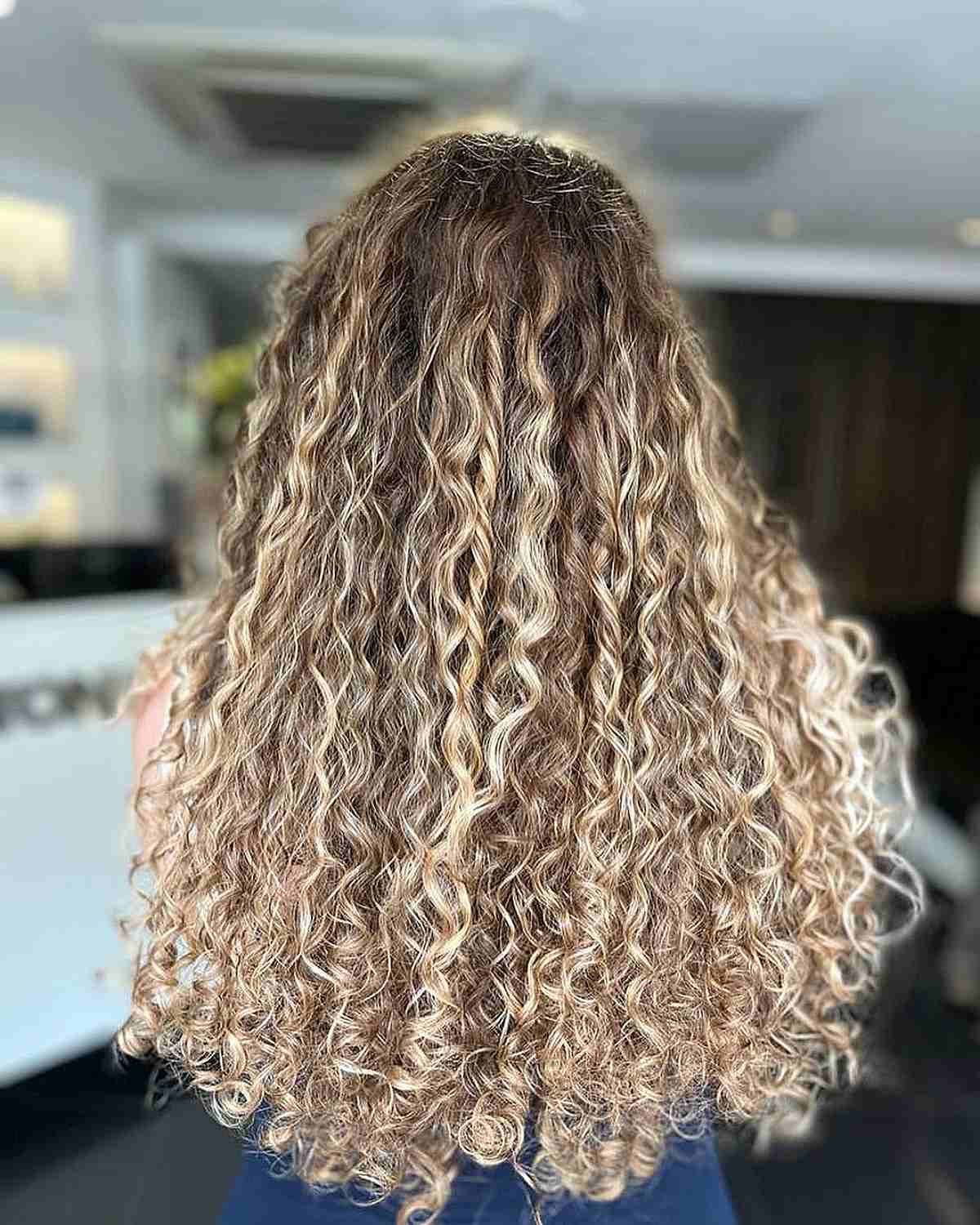Luxurious Long Sandy Blonde Balayage Curly Hair