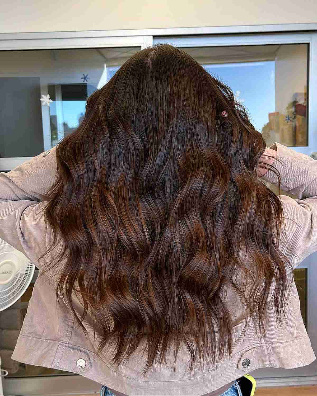 Luxurious Voluminous Waves on Deep Brown Tresses