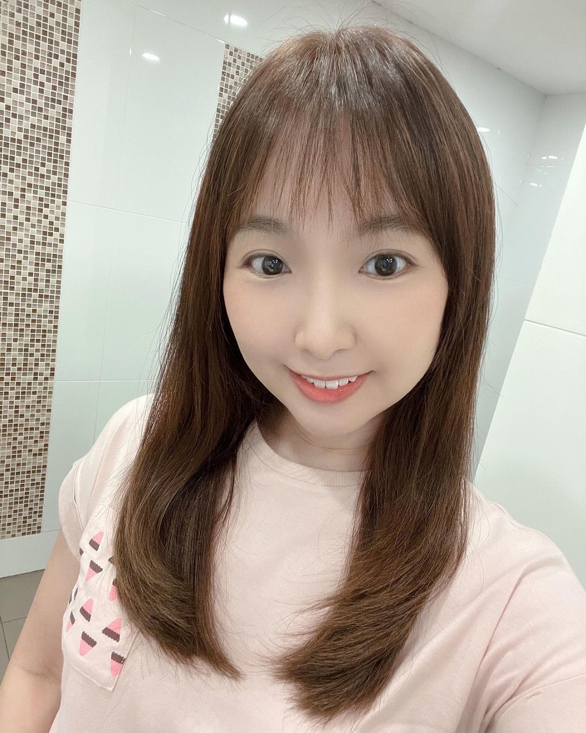 Medium Hairstyle Featuring a Delicate Fringe