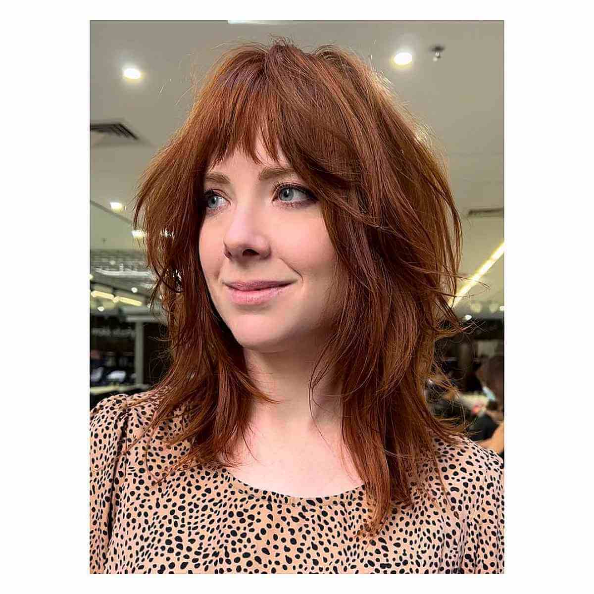 Medium Hairstyle Featuring Choppy Layers for Face-Framing