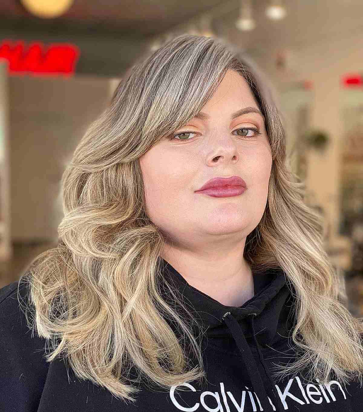 Medium Hairstyle Featuring Long Layers and Long Side Bangs
