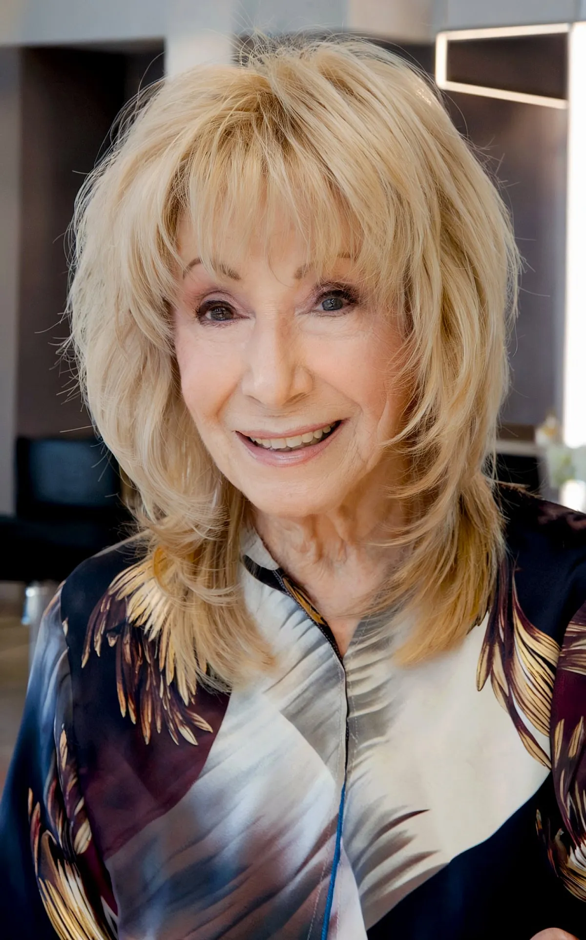 Medium Layered Shag with Soft Ends and Soft Bangs for Ladies Over Seventy