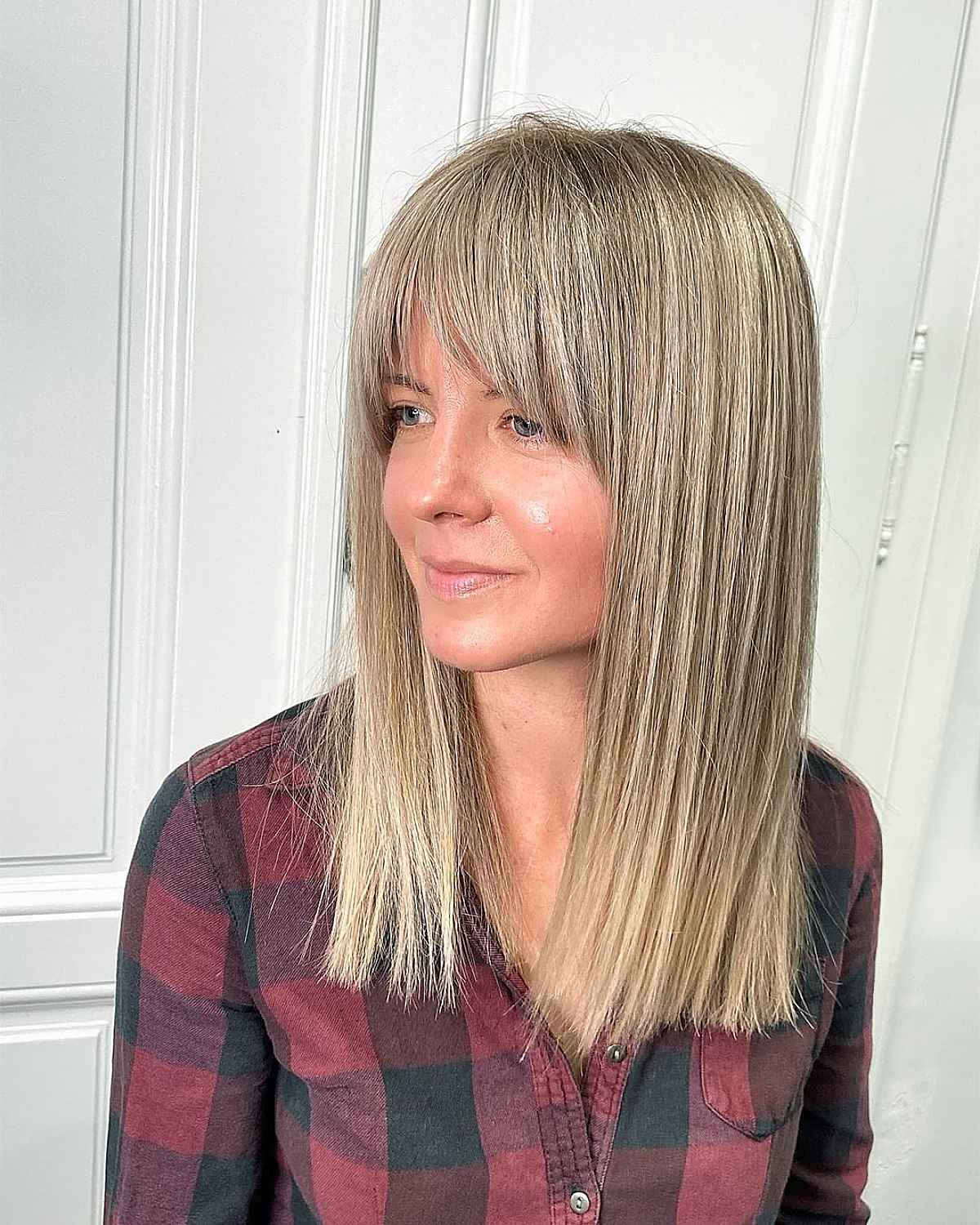 Medium-Length Blunt Hairstyle with Curtain Bangs