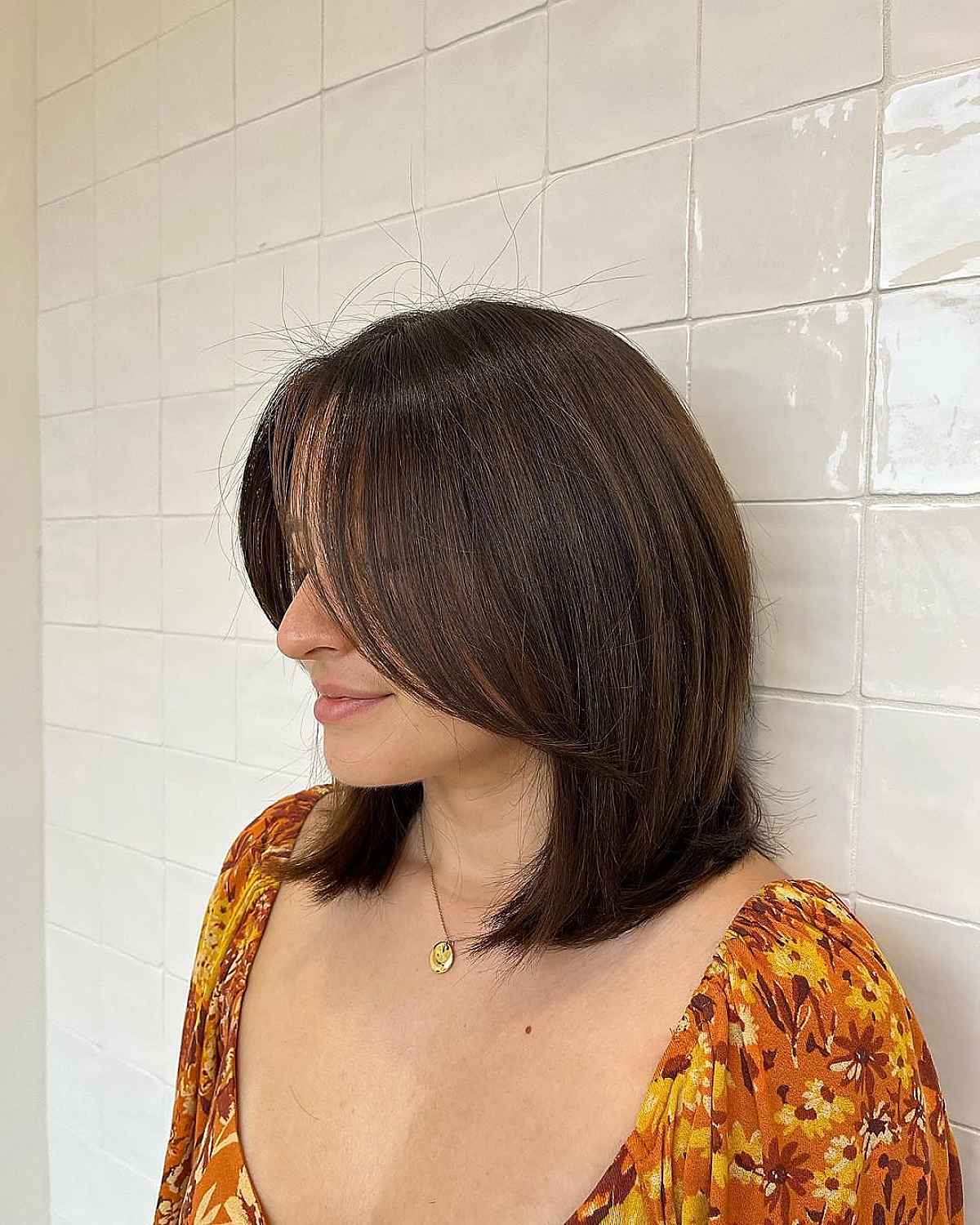 Medium-Length Cut with Extended Bangs