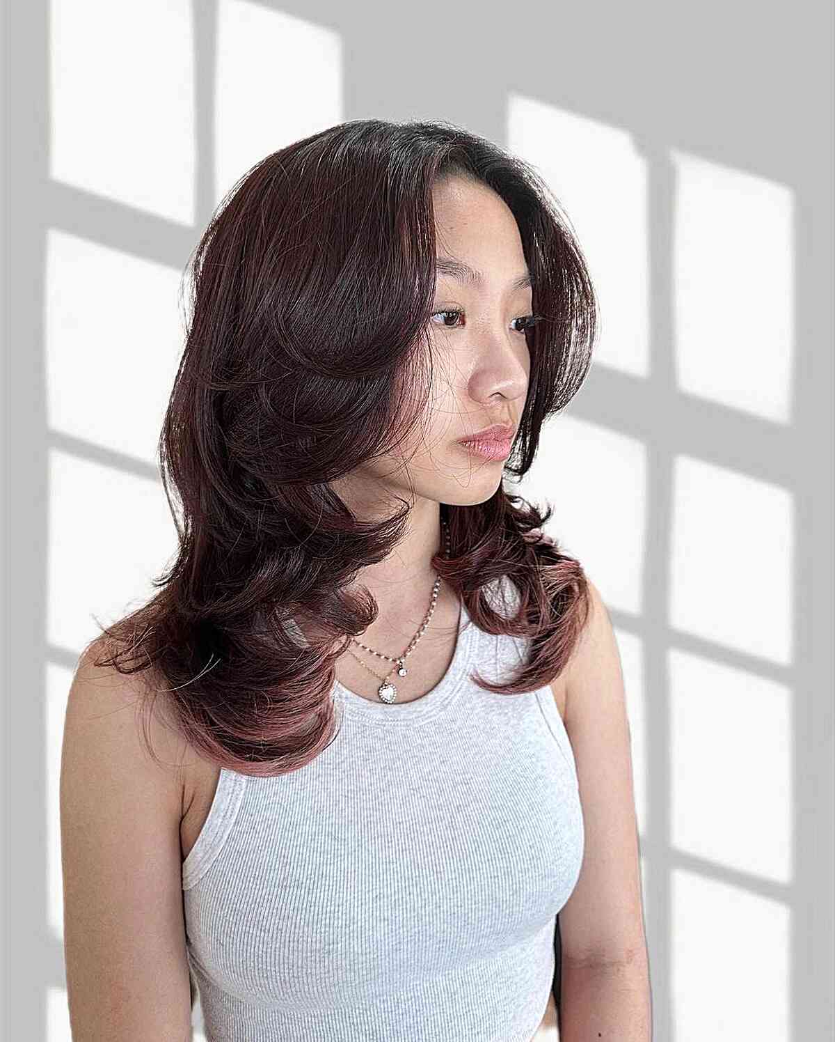 Dark Burgundy Medium Hair with Upturned Feathery Layers