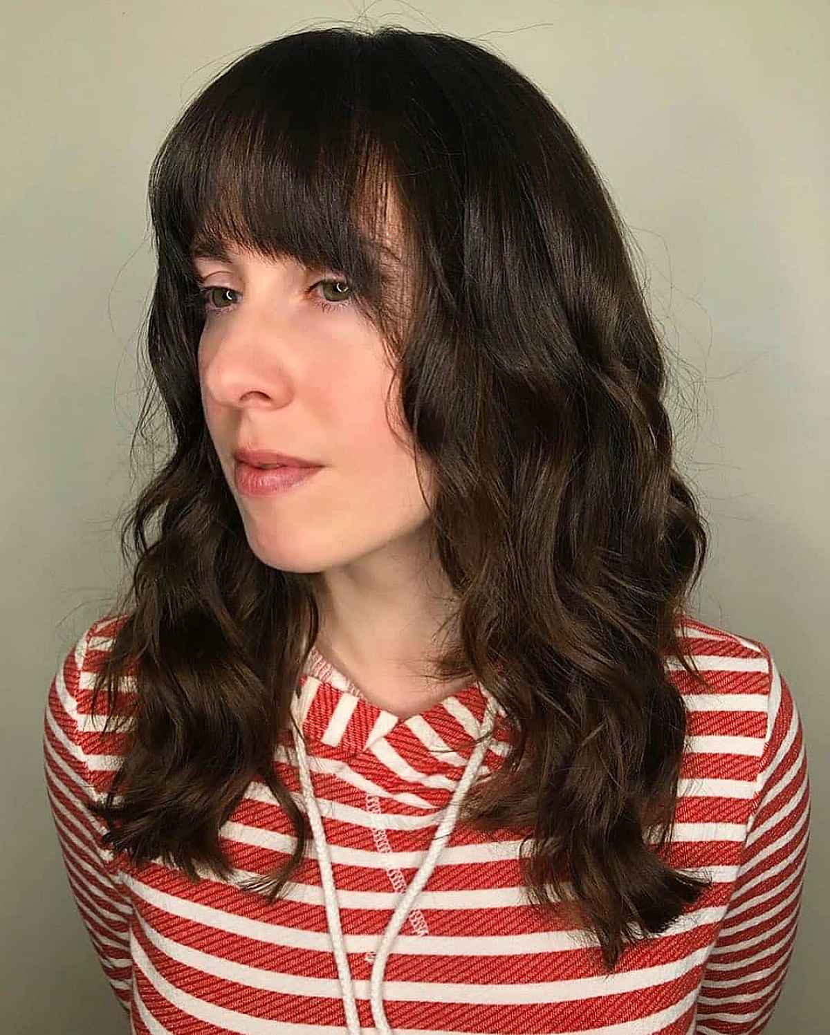 Medium-Length Hairstyle Featuring Gentle Feathered Bangs