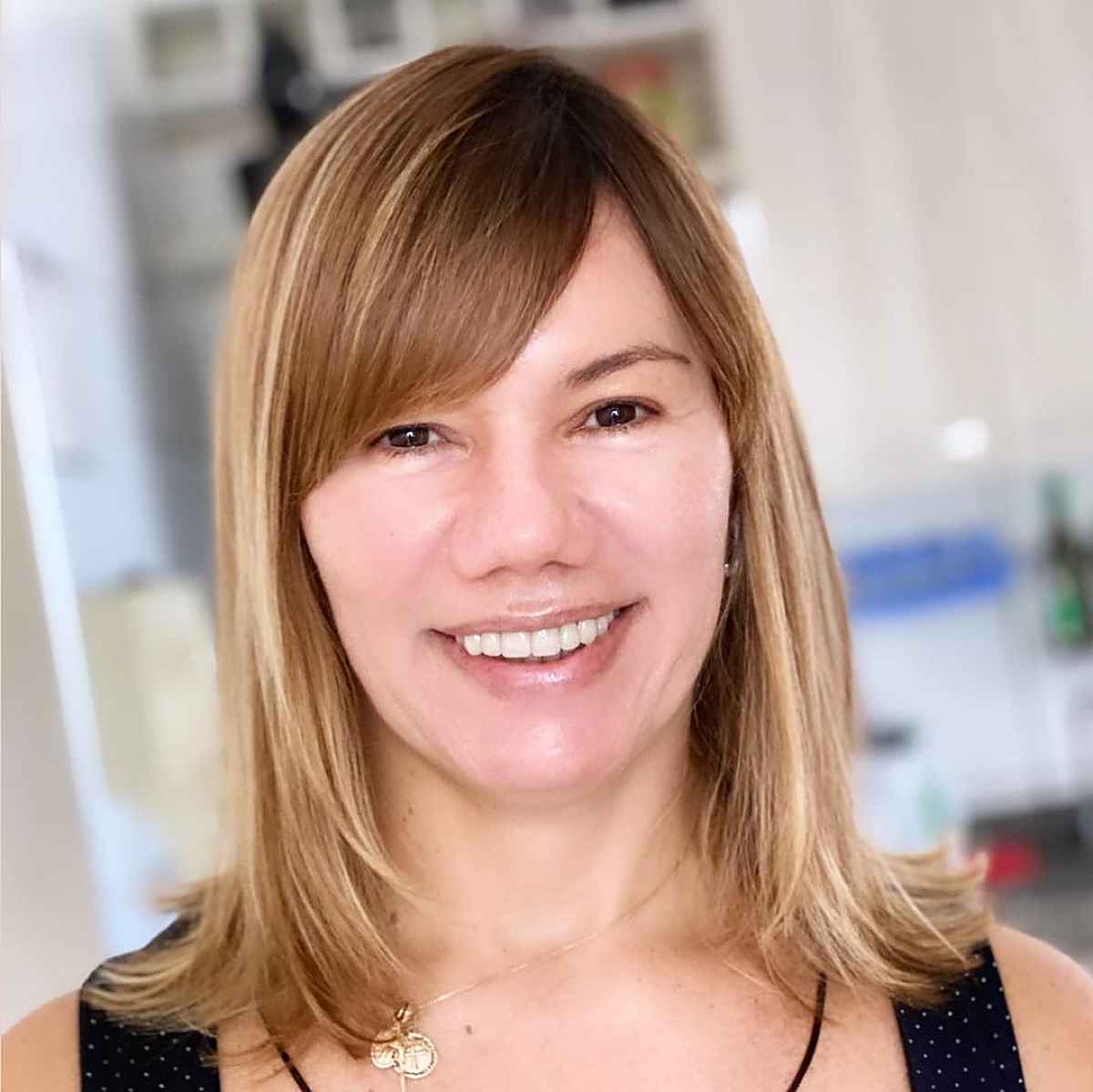 Medium-Length Hairstyle with Side-Swept Bangs