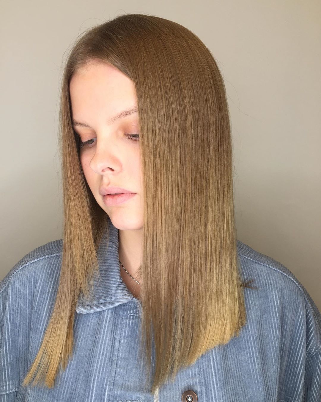 Medium-Length Sandy Blonde on Sleek Locks