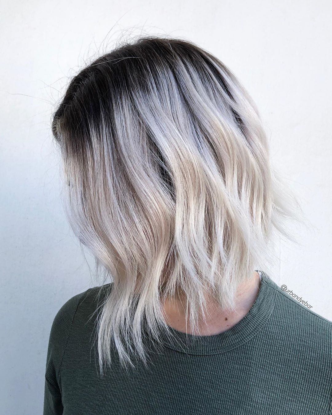 Medium-Length White Blonde Hair with Dark Roots