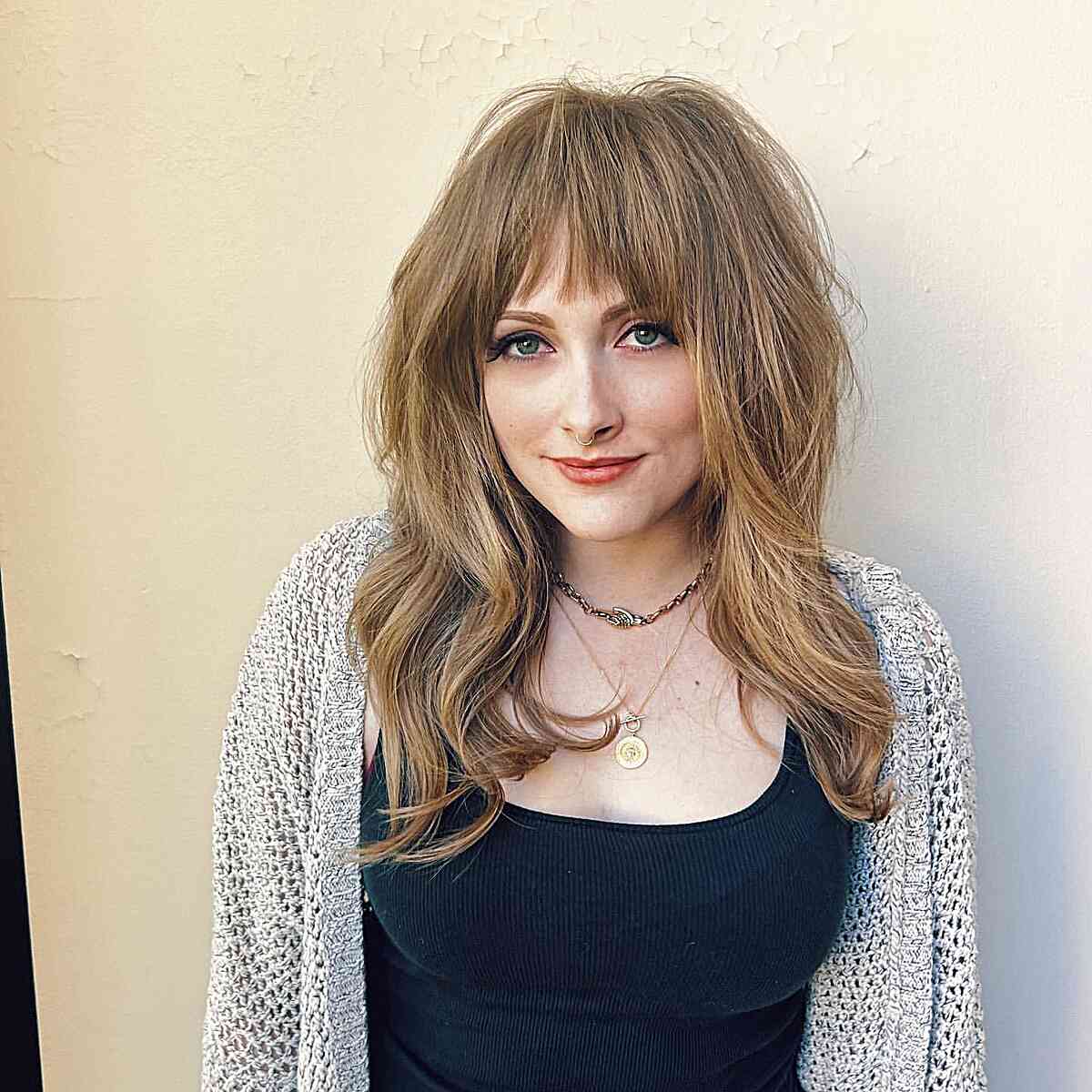 Medium Shag Featuring Internal Layering and Bangs for light brown hair