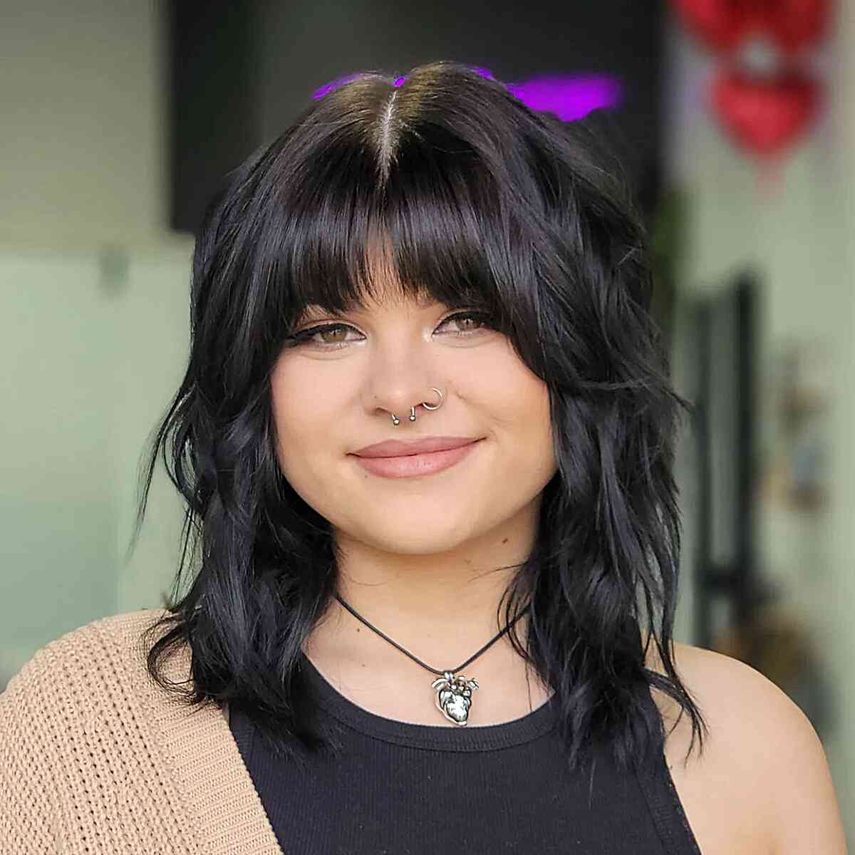 Medium Shaggy Textured Hairstyle with Bangs for women with round faces