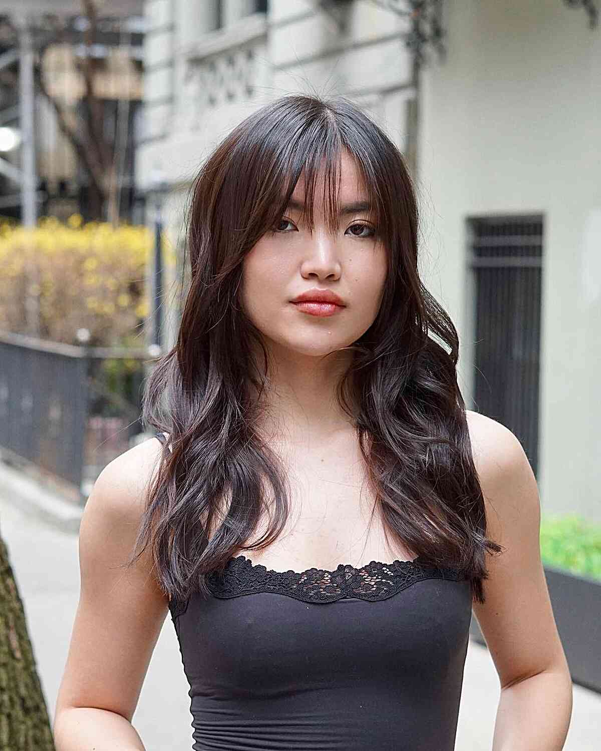 Medium-Length Soft Waves and Straight Wispy Bangs