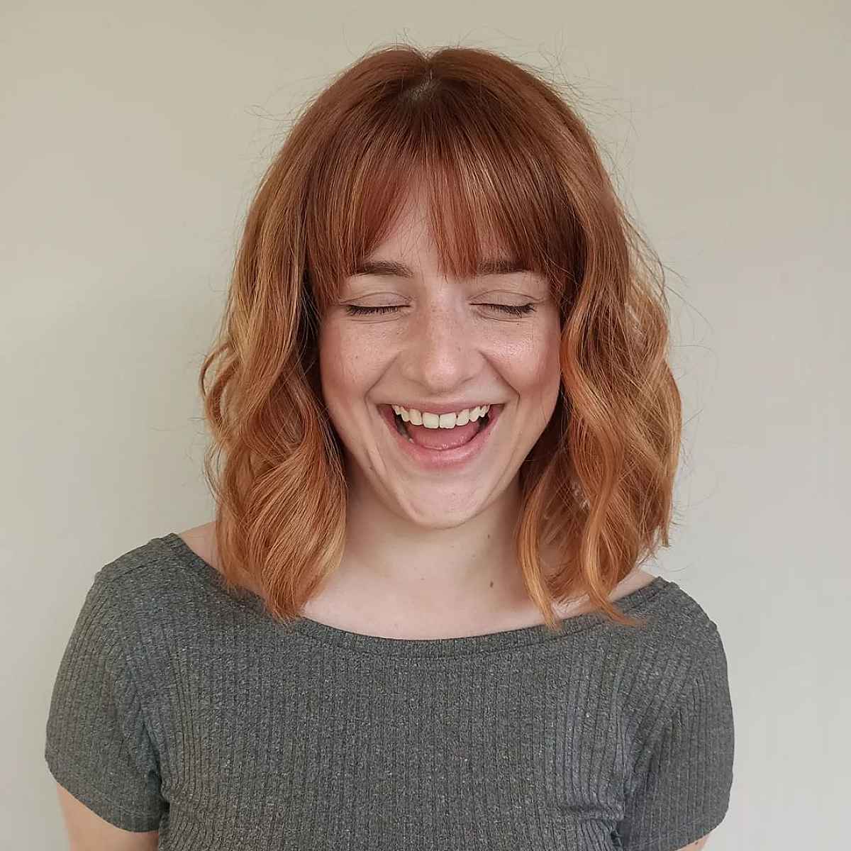 Medium Wavy Hair Featuring Straight Bangs