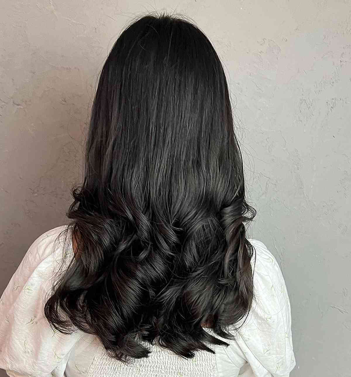 Mid Back-Length Black Hair with Gentle Permed Curls