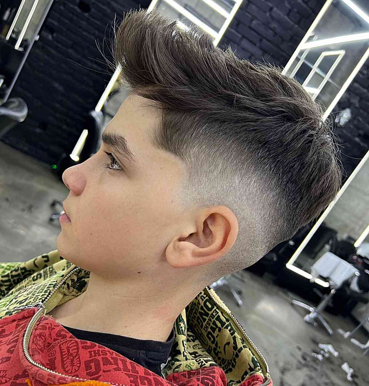 Mid Fade with Quiff Style for Boys featuring long hair on top and shorter sides