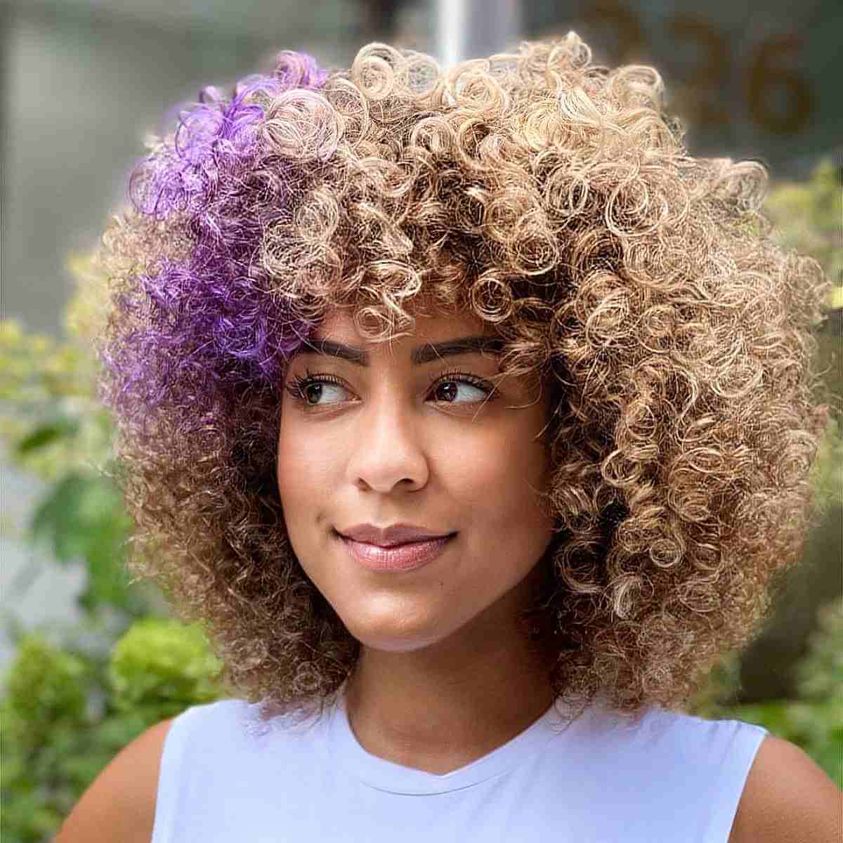 Mid-Length Curly Bronde Hair with Purple Accents