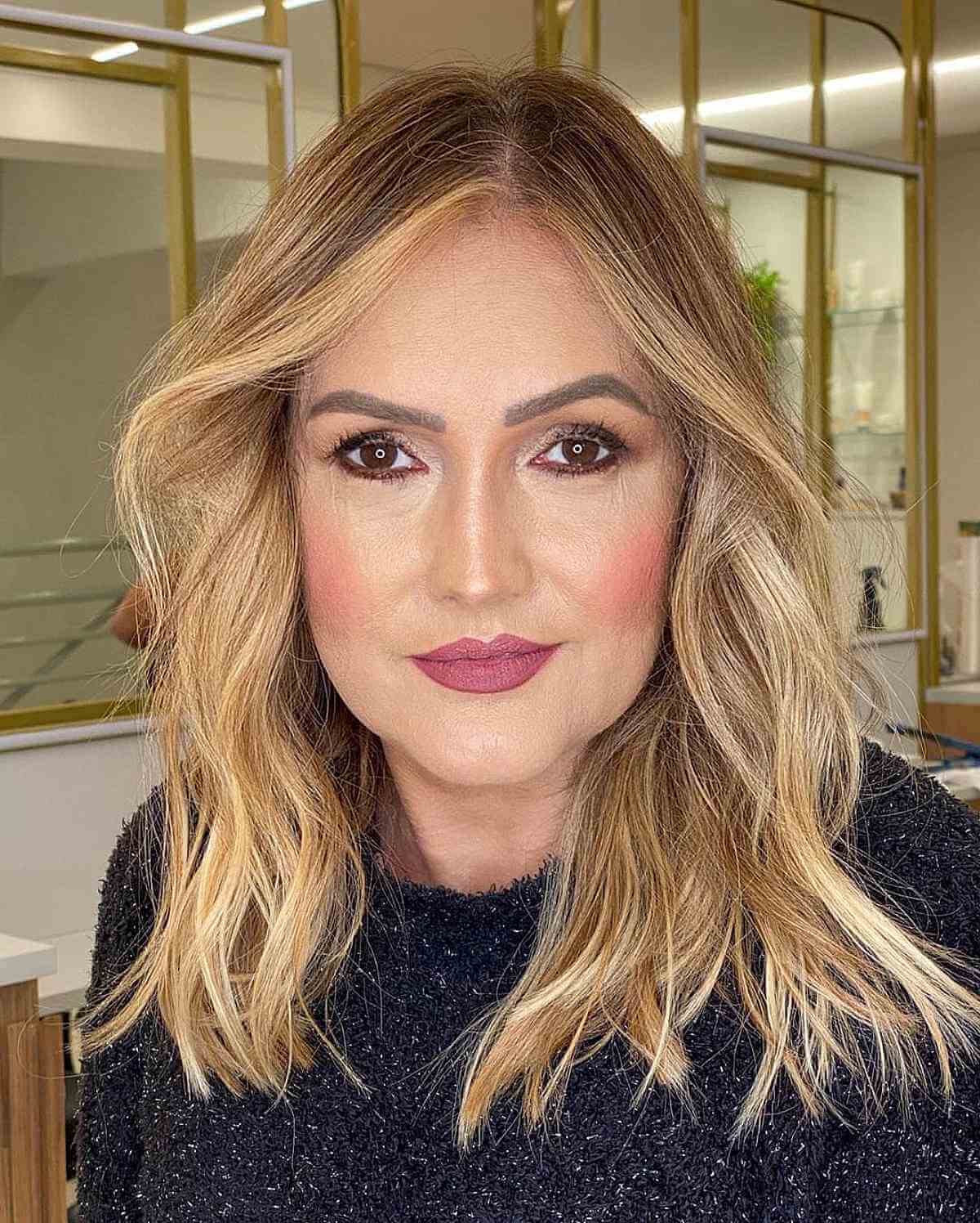 Mid-Length Cut with an Off-Center Part for Women in Their 50s