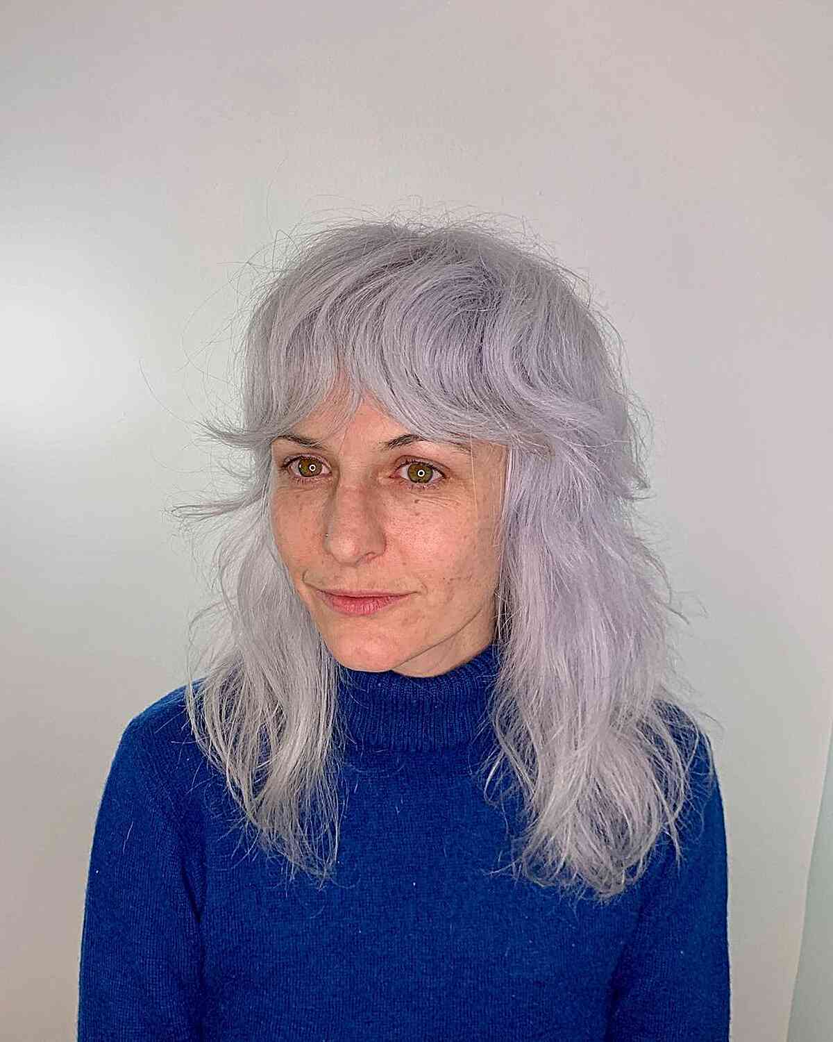 Mid-Length Silver Shag with Curtain Fringe for Mature Women featuring wispy ends and suited for thick hair