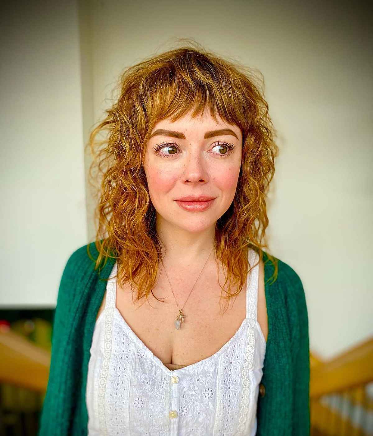 Mid-Length Soft Curls with Short Bangs