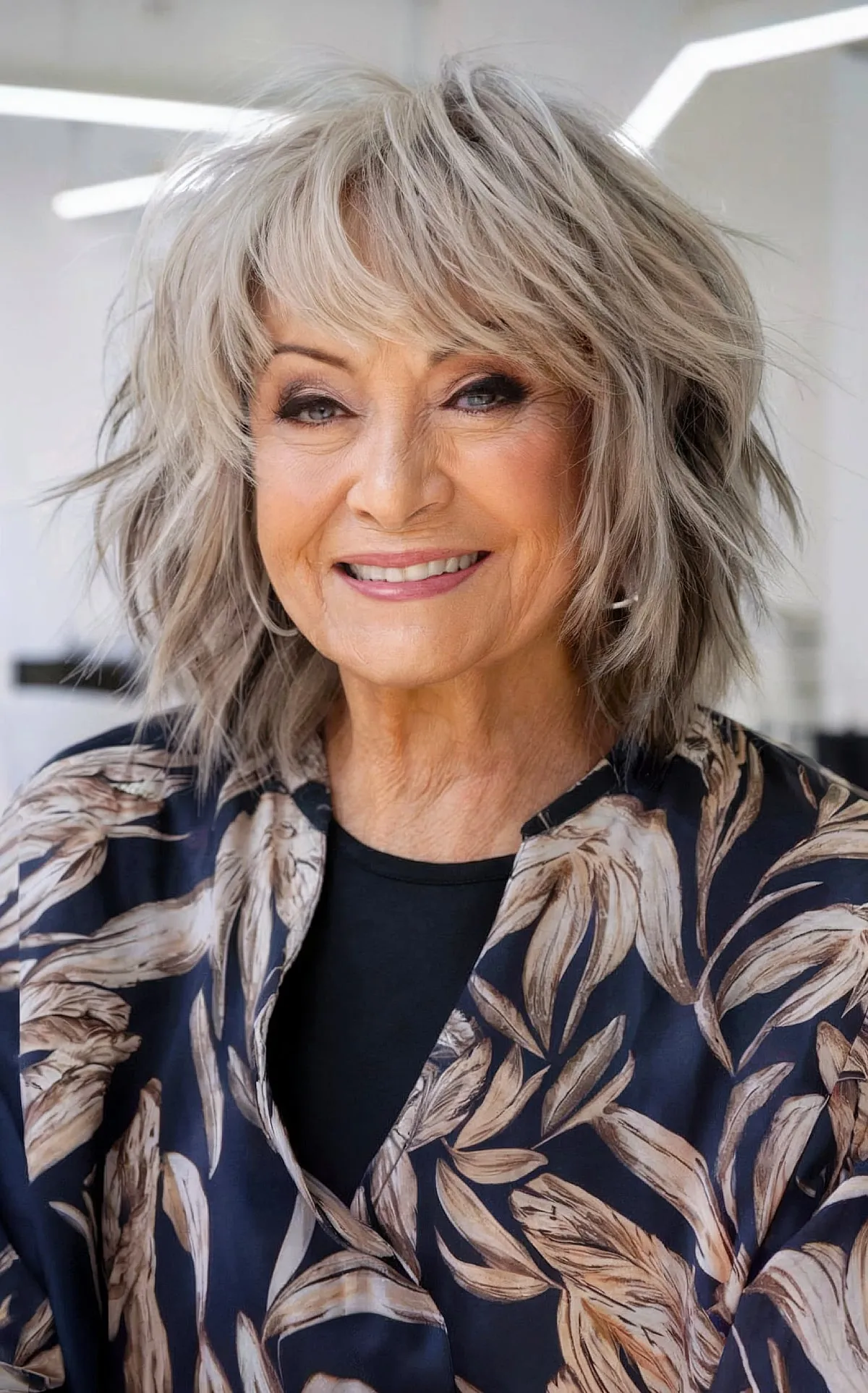 Shaggy Mid-Length Tousled Wavy Look with Subtle Bangs for Women Over Seventy